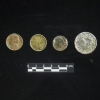 <p>Examples of coins recovered during the 2005-2006 archeological survey of Davids Island. Left to right are 1946 U.S. nickel; 1954 Republic of India 1-pice coin; 1899 U.S. Indian-head cent; and 1838 U.S. large cent.</p>